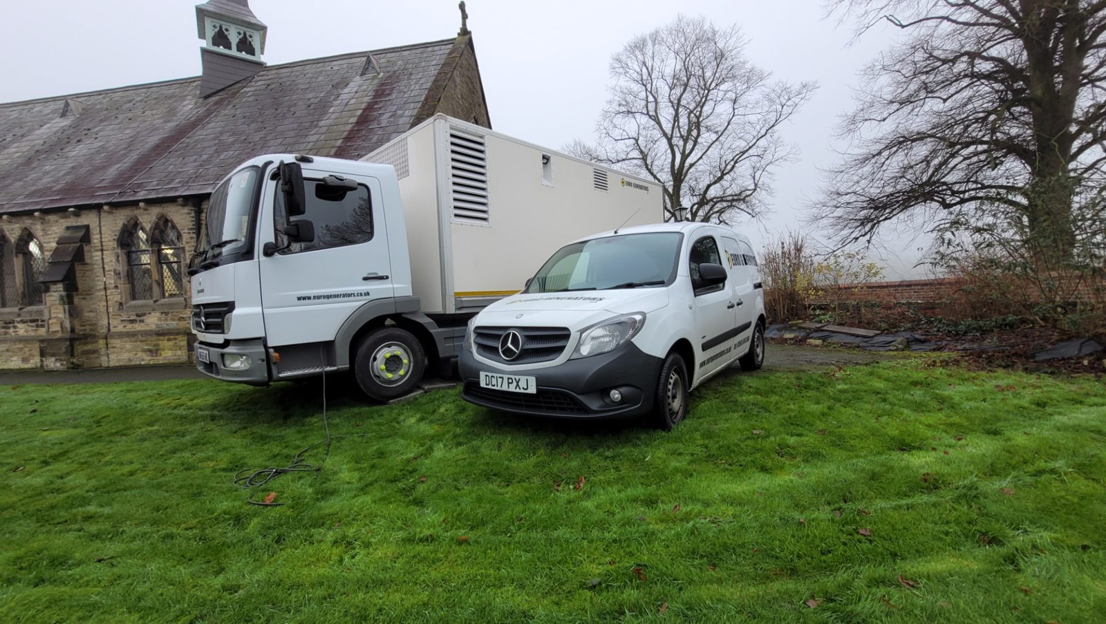 Lorry-mounted Euro Generators set on location beside a church