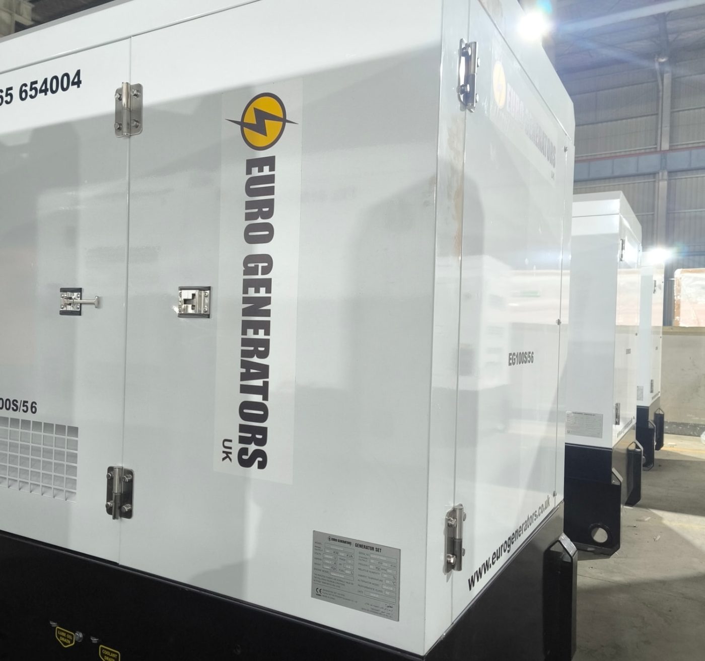 Side of the canopy with Euro Generators UK branding and drain points